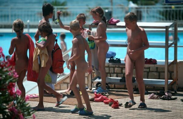 Purenudism family photo - nudists in an aquapark